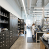 Heavy-duty dark grey laboratory storage cabinets with drawers in a modern research facility
