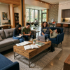 Solid wood student dormitory lounge coffee table with steel frame surrounded by studying college students