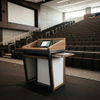 Higher Education Lectern used by an instructor for multimedia teaching in a modern curved university lecture hall