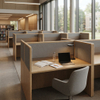 A quiet, focused corner of a university library with a row of minimalist acoustic modular study desks. Each wood-finished carrel includes a black task light, power outlets, and a grey acoustic panel, providing a private study zone for students in ergonomic chairs.