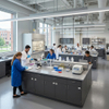 Double-sided central island benches with wood grain cabinets and integrated reagent shelving in a university science lab