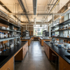 Ergonomic physics lab workbenches with overhead service channels in a modern college laboratory