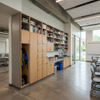 Built-in University Storage Solutions and Classroom Storage Cabinets featuring custom wooden lockers and open shelving
