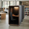 Enclosed single student desk pod equipped with acoustic insulation and power modules