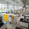 Yellow safety chemical storage cabinet integrated into high education research lab storage layout