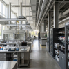Dark grey floor-standing lab cabinets and chemistry workstations in a modern university facility
