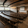 Curved commercial educational seating layout featuring premium university student desks and chairs